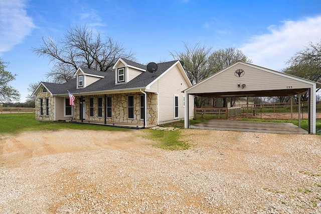 view of front of house with a carport and covered porch