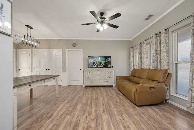 living room with crown molding, hardwood / wood-style flooring, and ceiling fan