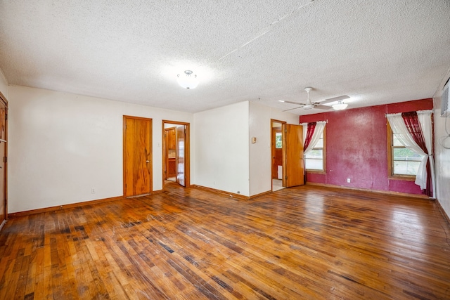 empty room with hardwood / wood-style floors, a textured ceiling, and ceiling fan