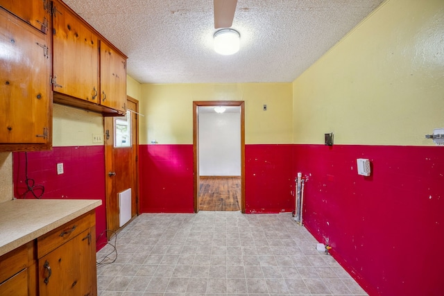 kitchen featuring a textured ceiling