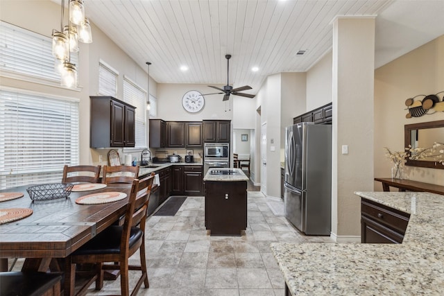 kitchen featuring pendant lighting, dark brown cabinets, stainless steel appliances, a center island, and wooden ceiling