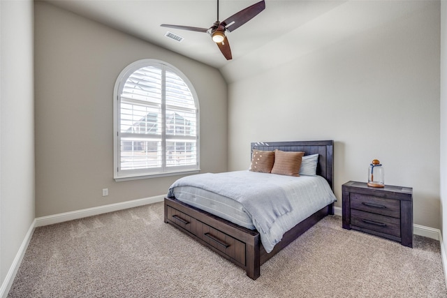 bedroom with light carpet, lofted ceiling, and ceiling fan