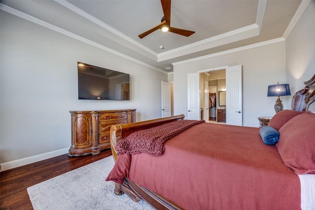 bedroom with a raised ceiling, ornamental molding, ceiling fan, and dark hardwood / wood-style flooring