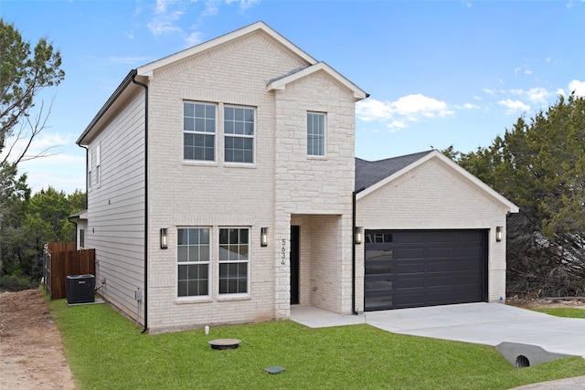 view of front of house featuring cooling unit, a garage, and a front yard