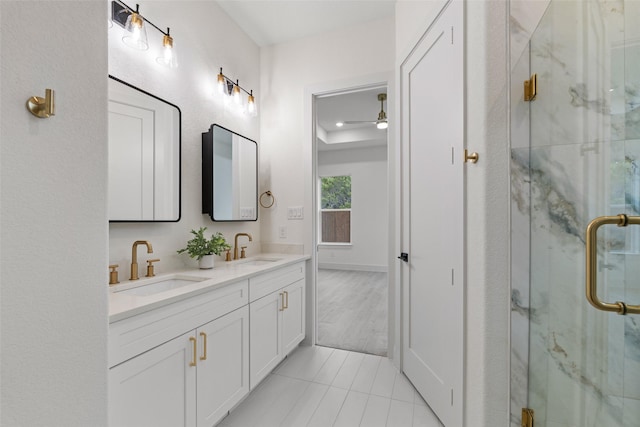 bathroom featuring walk in shower, tile patterned floors, and vanity