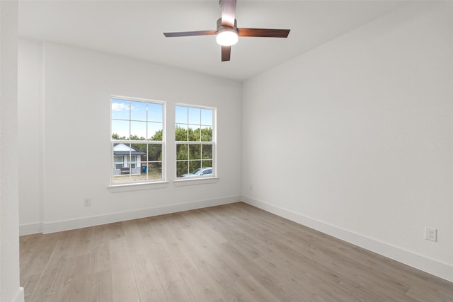 empty room with light hardwood / wood-style flooring and ceiling fan