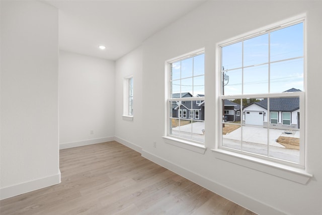 unfurnished room featuring light hardwood / wood-style floors