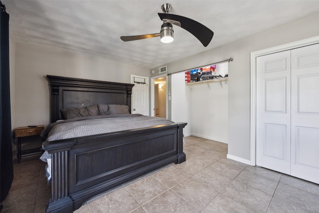 bedroom featuring tile patterned flooring and ceiling fan