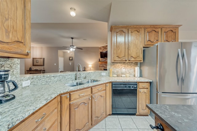 kitchen with sink, light tile patterned floors, stainless steel refrigerator, dishwasher, and backsplash