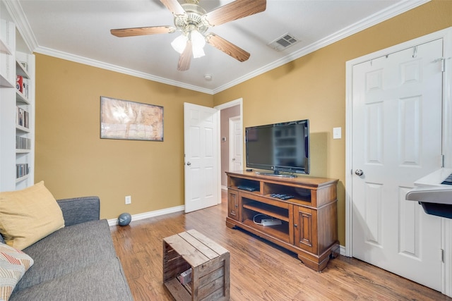 living room featuring crown molding, ceiling fan, and wood-type flooring