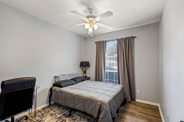 bedroom with hardwood / wood-style flooring and ceiling fan