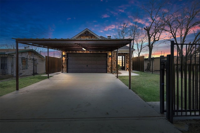 view of front of house with a carport, a garage, and a lawn