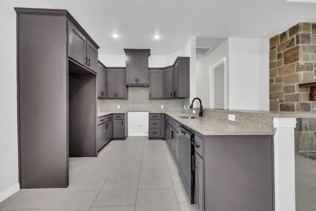 kitchen featuring gray cabinets, black dishwasher, sink, backsplash, and kitchen peninsula