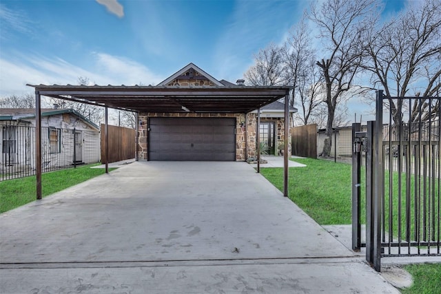 view of front of property featuring a carport, a garage, and a front yard