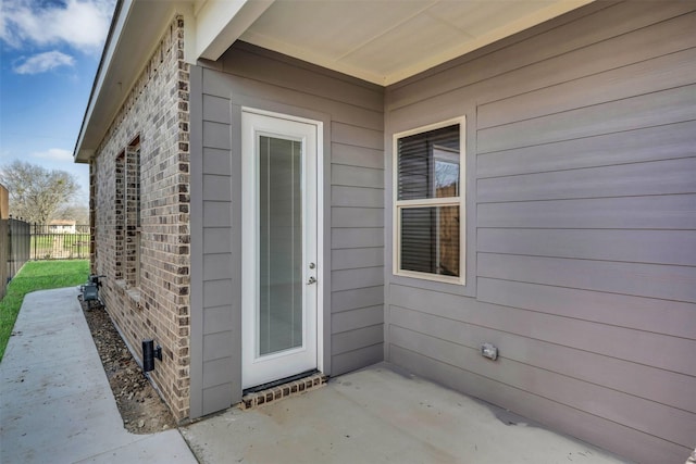 entrance to property with a patio