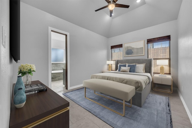 tiled bedroom featuring vaulted ceiling, ceiling fan, and ensuite bath