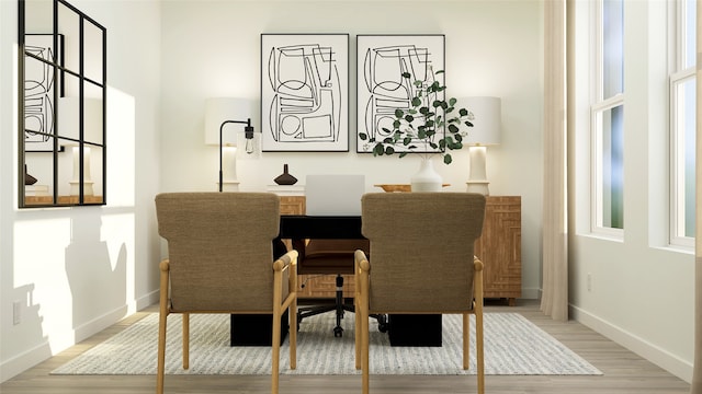 dining room featuring hardwood / wood-style flooring and a wealth of natural light