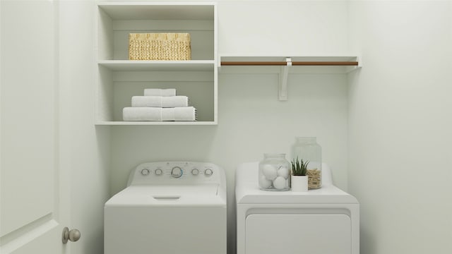 clothes washing area featuring washer and clothes dryer