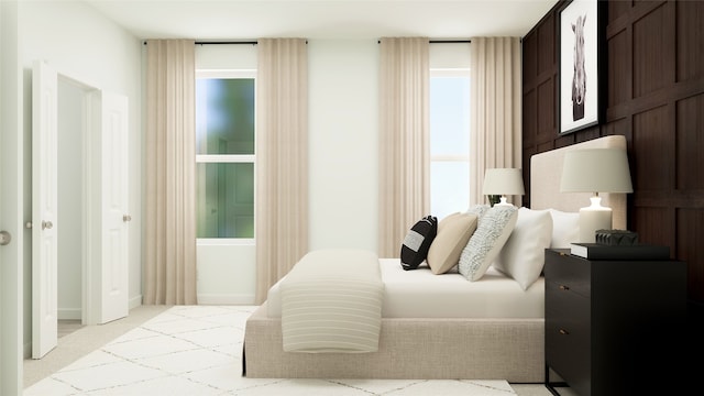 carpeted bedroom with multiple windows