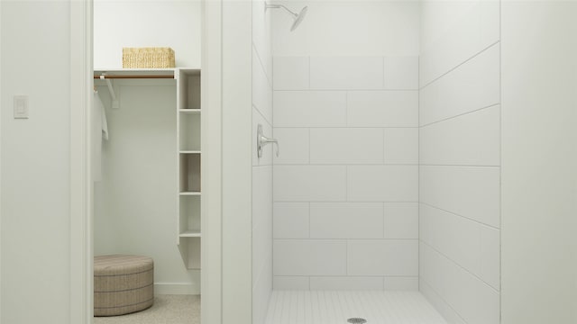 bathroom with tiled shower