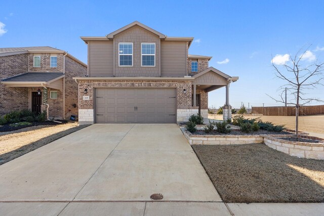 view of front of property with a garage