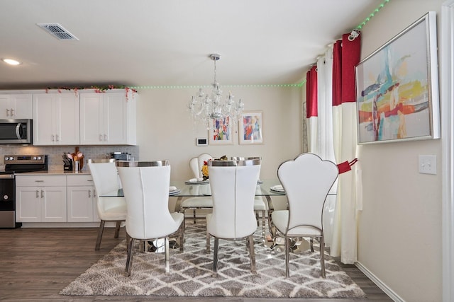 305 Grenada Lake Dr, Princeton, TX 75407 - dining room featuring an inviting chandelier and dark hardwood / wood-style flooring