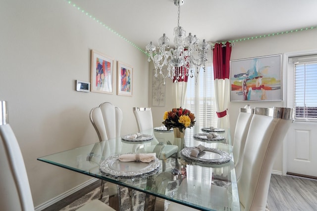305 Grenada Lake Dr, Princeton, TX 75407 - dining space with light wood-type flooring and a chandelier