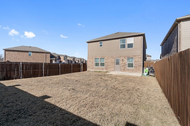 305 Grenada Lake Dr, Princeton, TX 75407 - rear view of house with a lawn and a patio