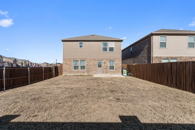305 Grenada Lake Dr, Princeton, TX 75407 - back of house with a yard and a patio