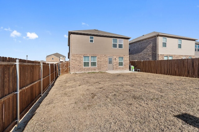 305 Grenada Lake Dr, Princeton, TX 75407 - rear view of house featuring a yard and a patio