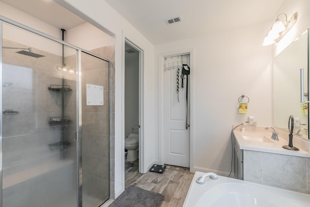 full bathroom with vanity, toilet, independent shower and bath, and wood-type flooring