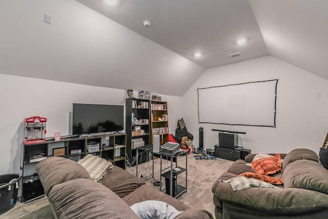 carpeted cinema room with lofted ceiling