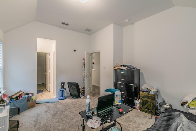 interior space featuring vaulted ceiling and carpet