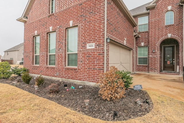 view of side of home with a garage