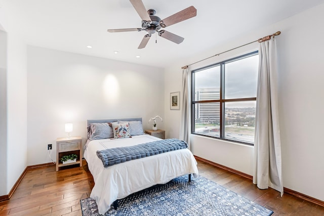 bedroom featuring light hardwood / wood-style flooring and ceiling fan