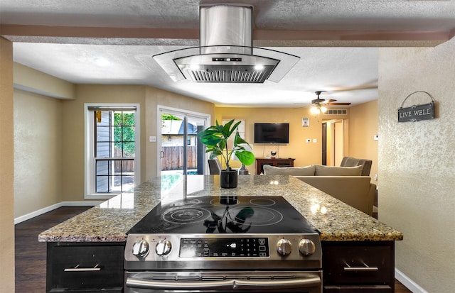 kitchen with island exhaust hood, light stone countertops, stainless steel electric range, and a textured ceiling