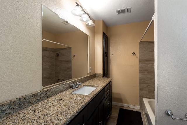 bathroom with vanity and wood-type flooring