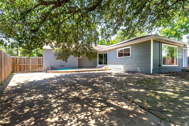 rear view of house with a patio area