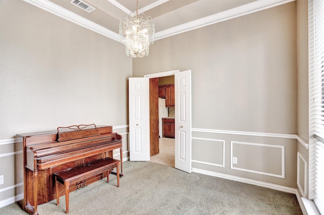 miscellaneous room with crown molding, light colored carpet, a raised ceiling, and an inviting chandelier