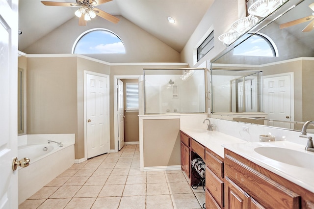 bathroom featuring a healthy amount of sunlight, vanity, shower with separate bathtub, and tile patterned flooring