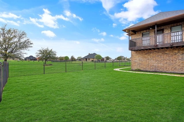 view of yard featuring a balcony