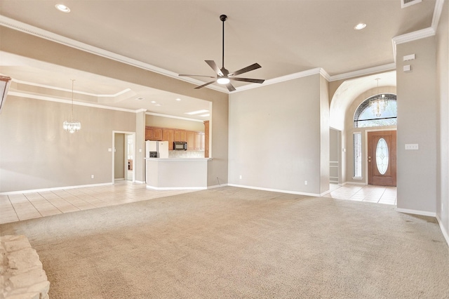 unfurnished living room featuring crown molding, ceiling fan with notable chandelier, light colored carpet, and a high ceiling