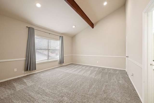 carpeted empty room featuring lofted ceiling with beams