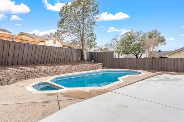 view of pool featuring an in ground hot tub and a patio