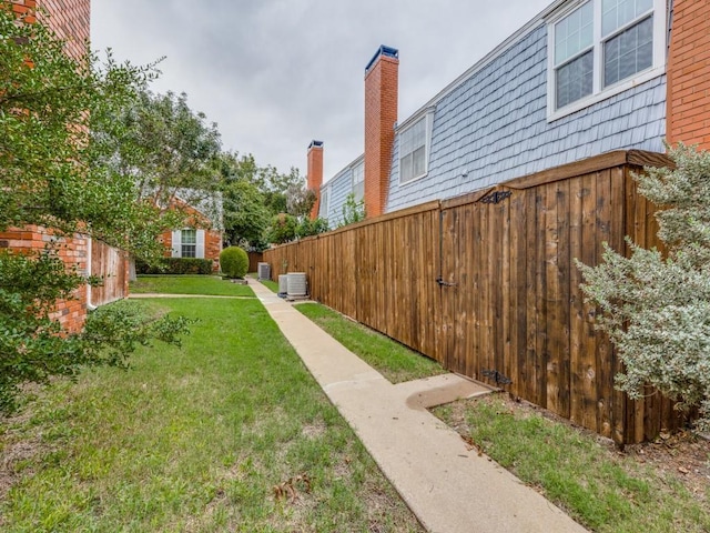 view of yard featuring central AC