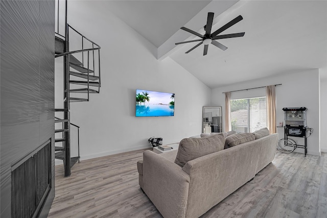 living room with ceiling fan, high vaulted ceiling, beamed ceiling, and light wood-type flooring