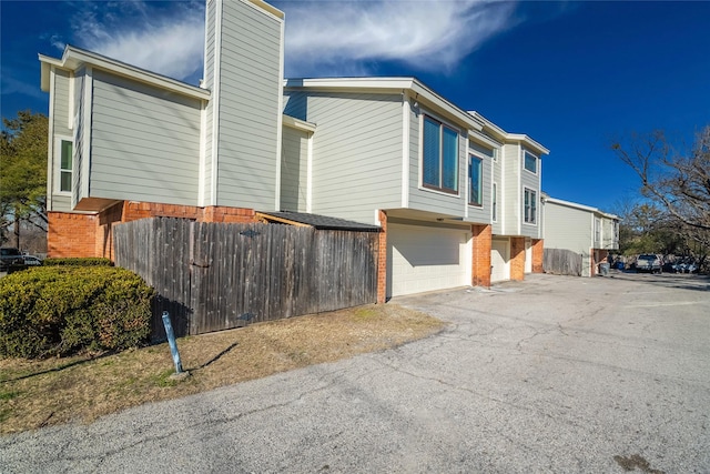 view of property exterior featuring a garage