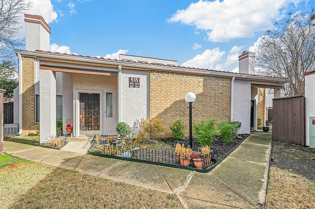 view of front of home featuring central AC unit