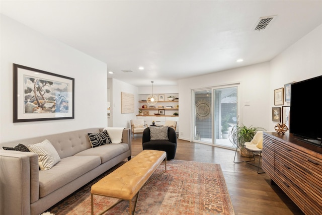 living room featuring dark wood-type flooring