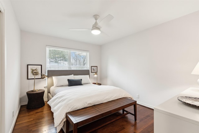 bedroom with dark wood-type flooring and ceiling fan